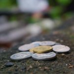Round Silver-colored Coins on Ground